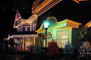 Holiday lights installed on exterior of larger home
